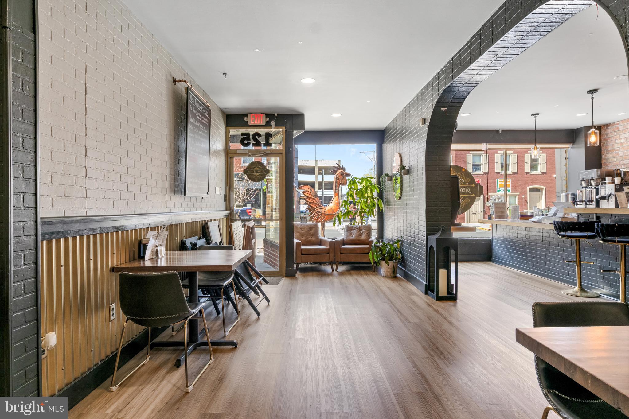 125 North George Street York, PA 17401 - Photo 7 of 56 a living room with furniture and wooden floor