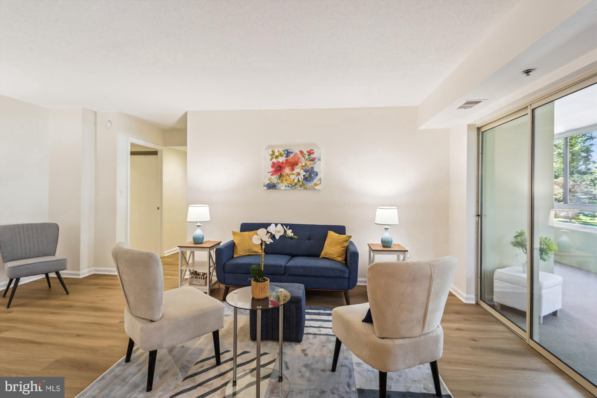 14801 Pennfield Circle, Unit 210 Silver Spring, MD 20906 - Photo 1 of 39 a living room with furniture and a wooden floor