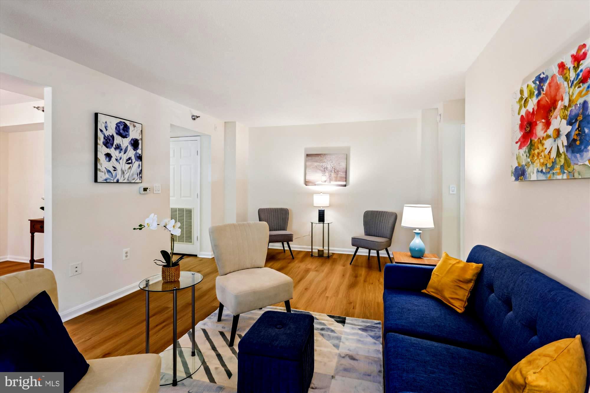 14801 Pennfield Circle, Unit 210 Silver Spring, MD 20906 - Photo 11 of 39 a living room with furniture and wooden floor