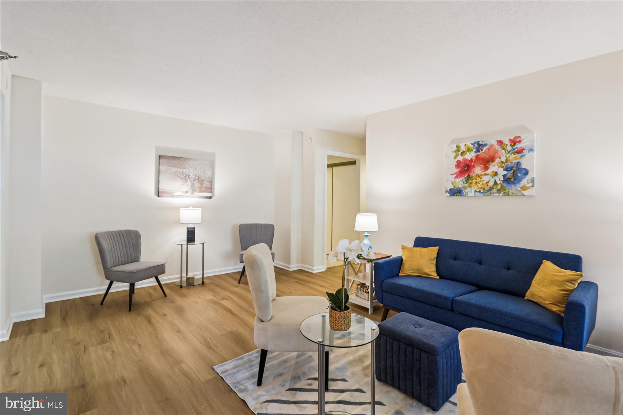 14801 Pennfield Circle, Unit 210 Silver Spring, MD 20906 - Photo 12 of 39 a living room with furniture and a wooden floor