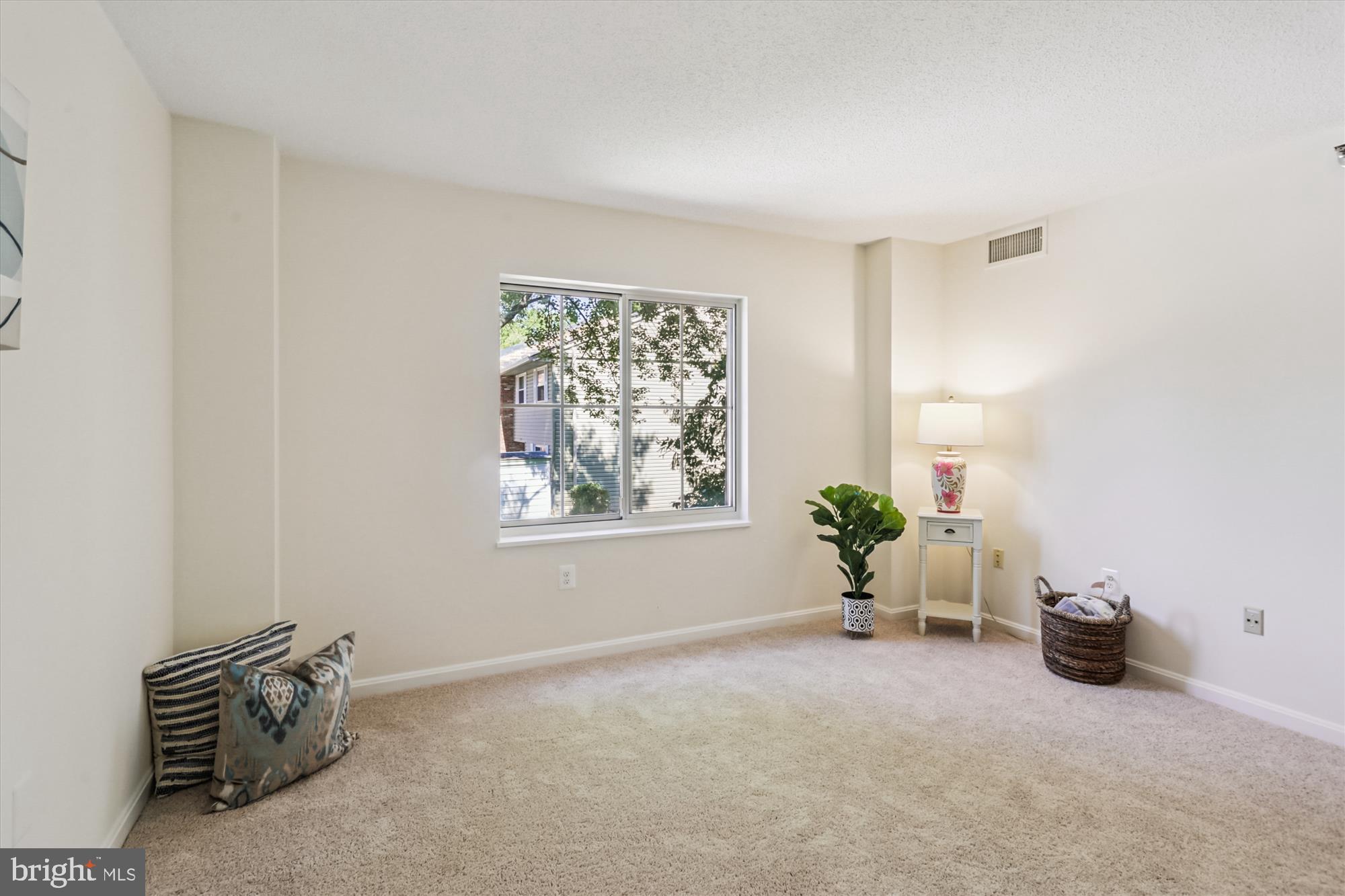 14801 Pennfield Circle, Unit 210 Silver Spring, MD 20906 - Photo 18 of 39 a view of livingroom with furniture and window