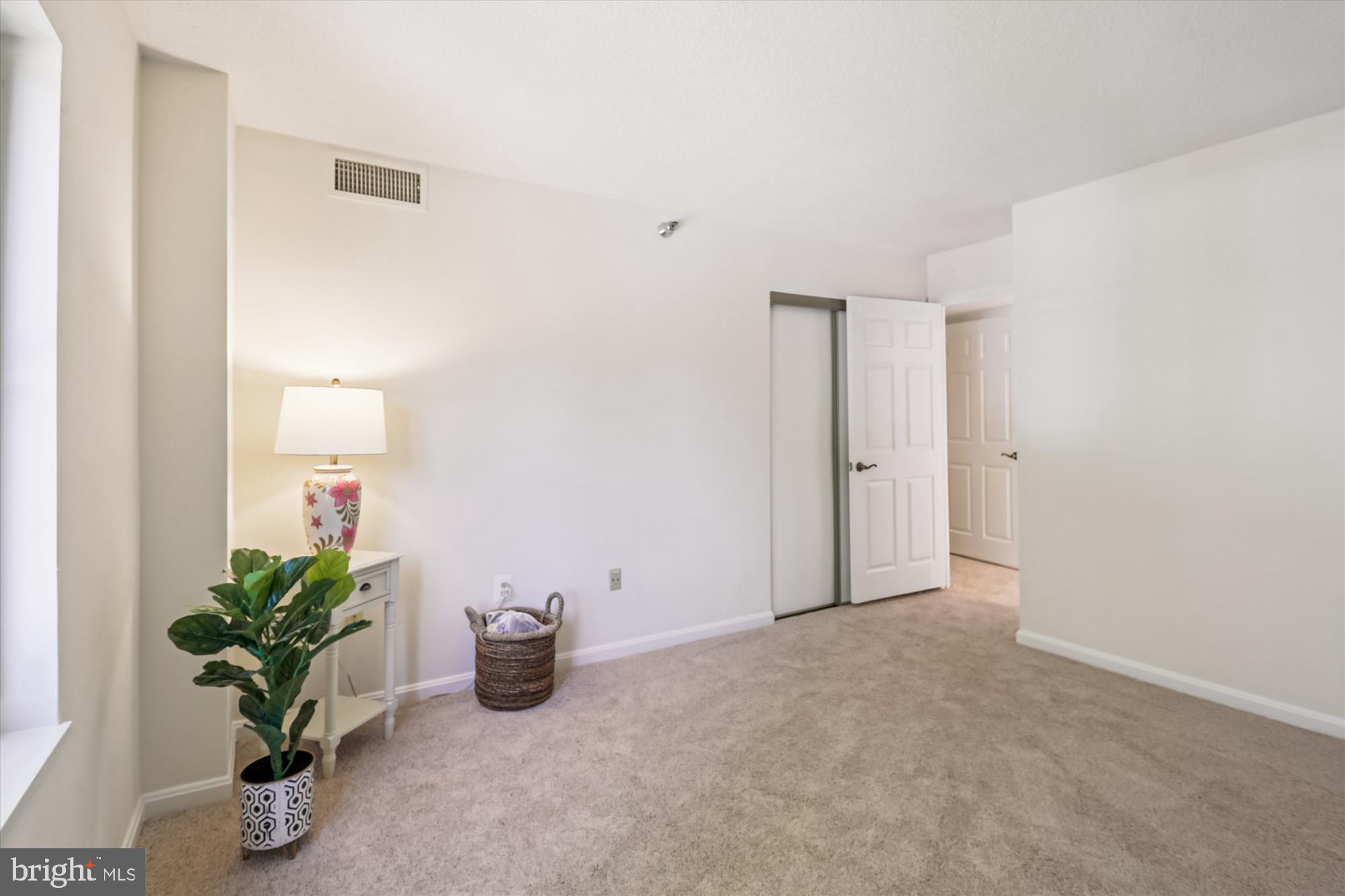 14801 Pennfield Circle, Unit 210 Silver Spring, MD 20906 - Photo 21 of 39 an empty room with potted plants
