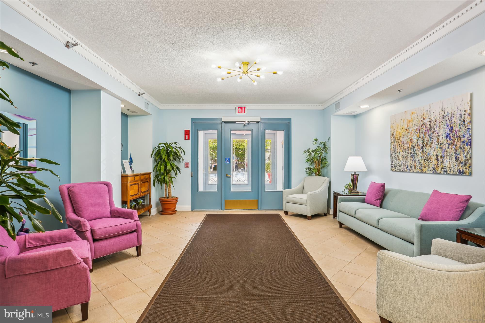 14801 Pennfield Circle, Unit 210 Silver Spring, MD 20906 - Photo 26 of 39 a living room with furniture and a large window