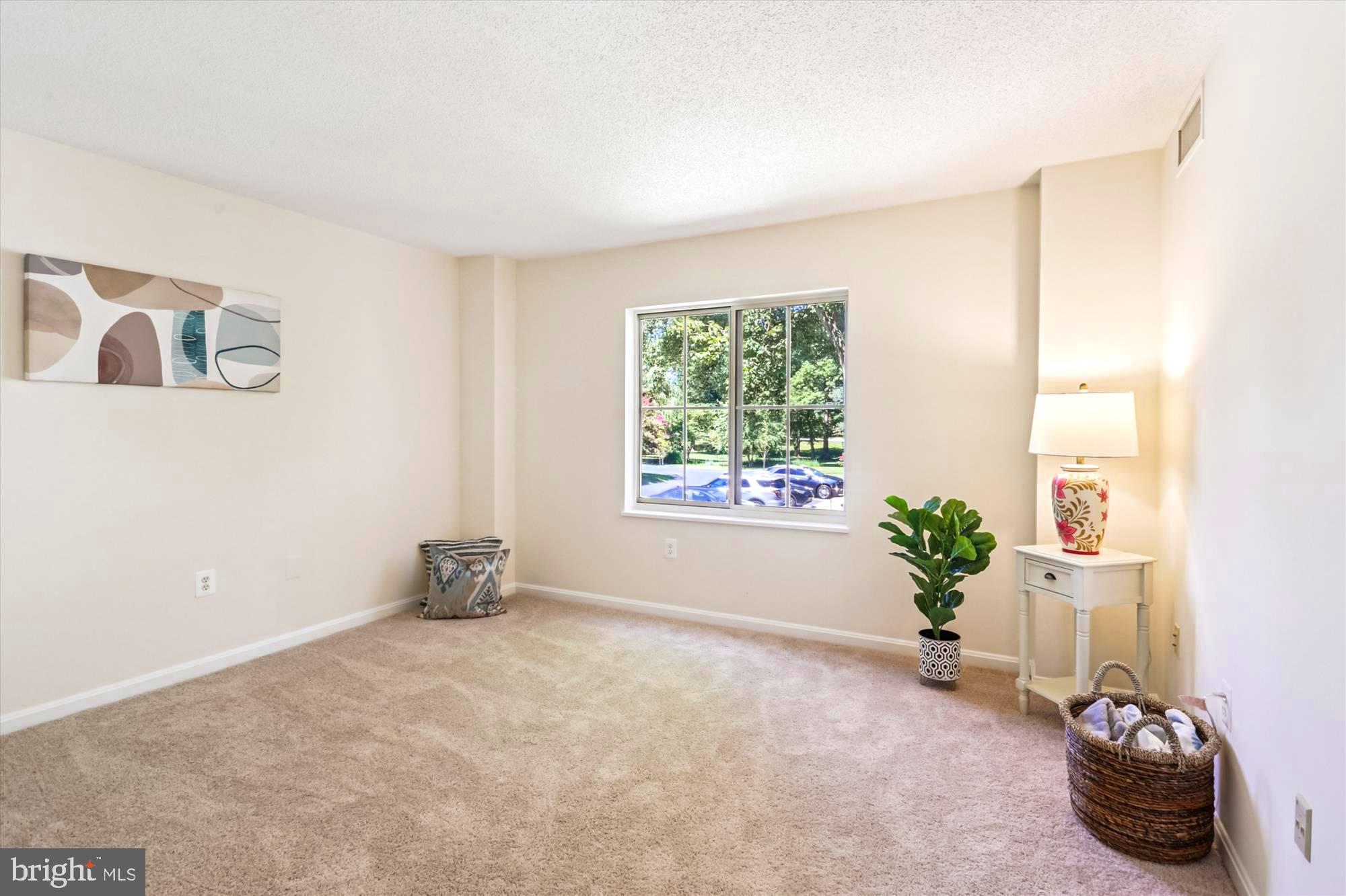 14801 Pennfield Circle, Unit 210 Silver Spring, MD 20906 - Photo 7 of 39 a view of an empty room with a window