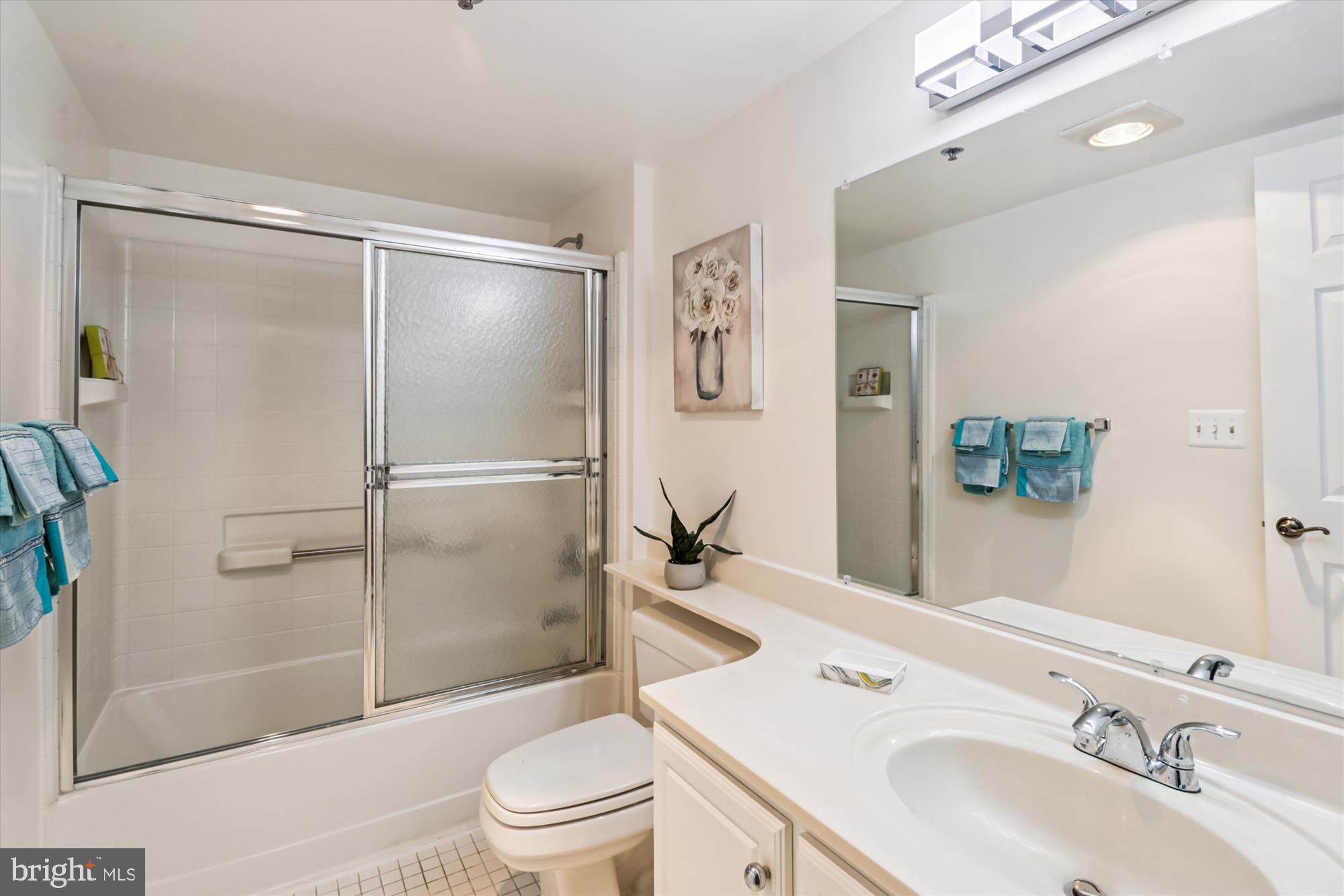 14801 Pennfield Circle, Unit 210 Silver Spring, MD 20906 - Photo 8 of 39 a bathroom with a sink toilet and shower