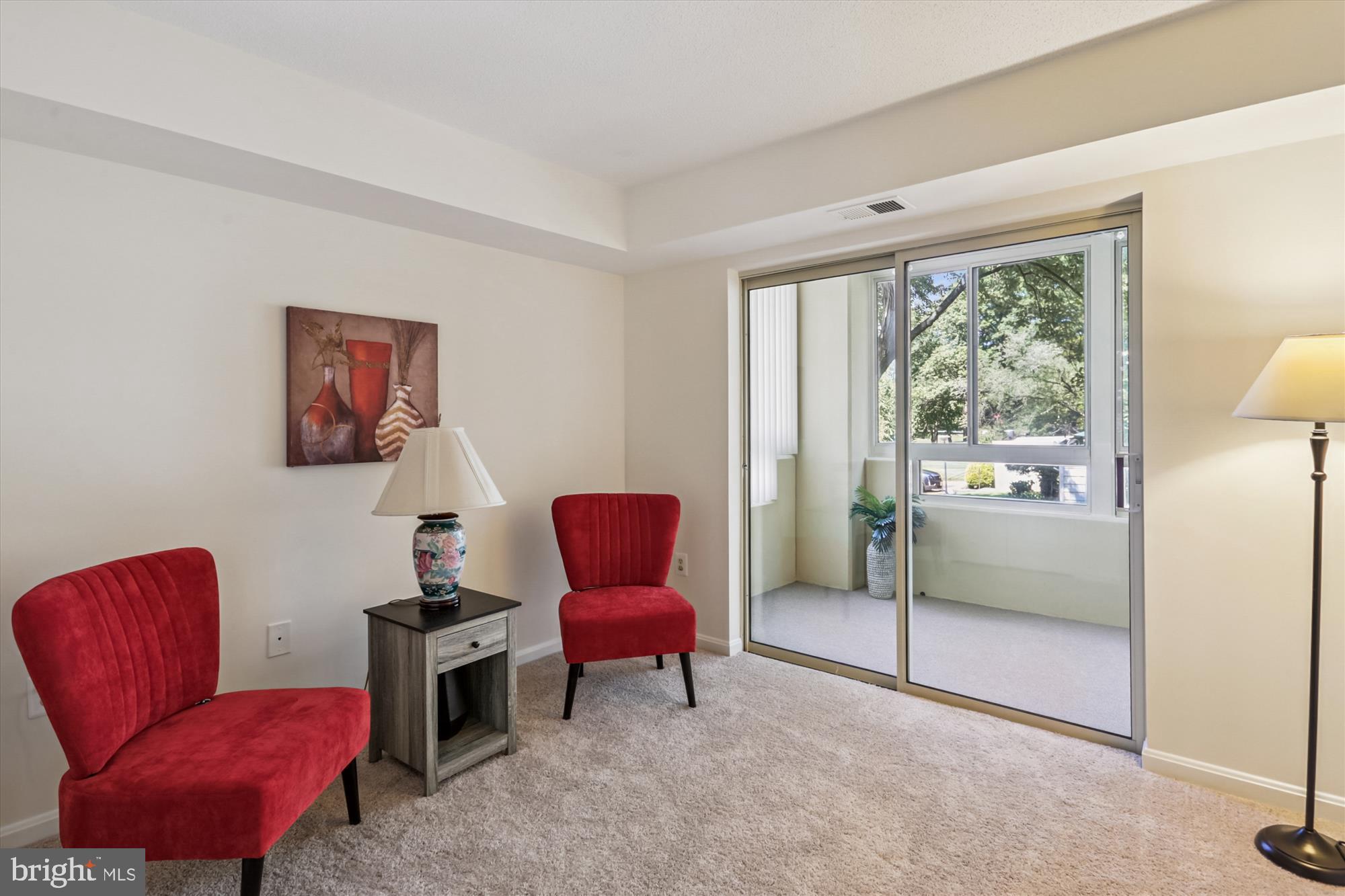 14801 Pennfield Circle, Unit 210 Silver Spring, MD 20906 - Photo 9 of 39 a room with furniture and a window