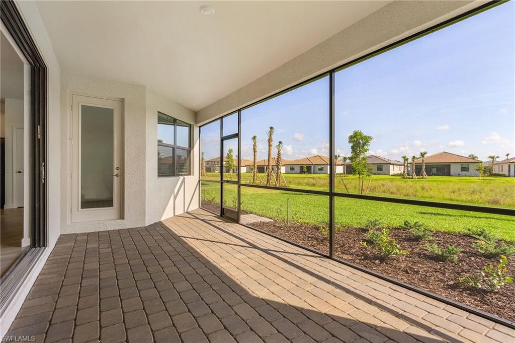 20662 Greenwich Place Estero, FL 33928 - Photo 21 of 26 a view of a house with a yard