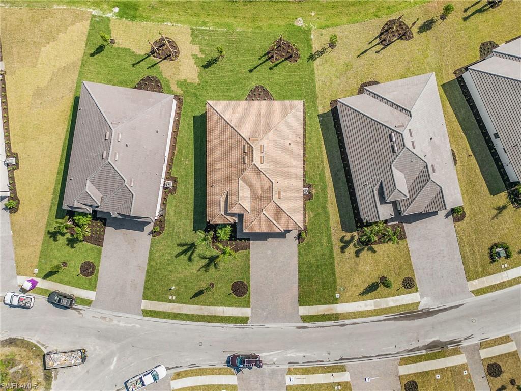 20662 Greenwich Place Estero, FL 33928 - Photo 25 of 26 an aerial view of a house with a yard and garage