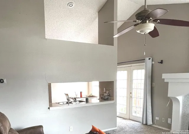 a bathroom with a sink a mirror and a window