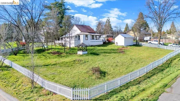 a view of a swimming pool with a yard