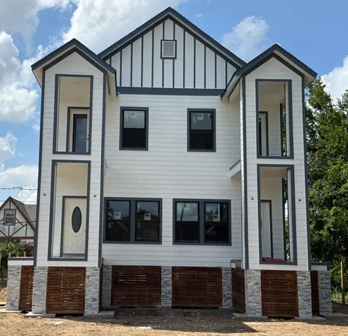 a front view of a house with a street