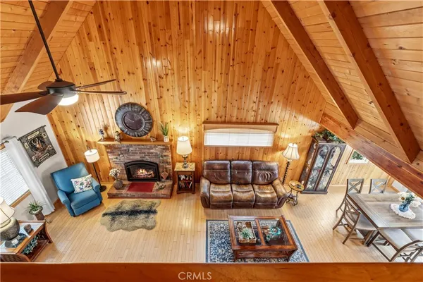 a view of living room with furniture and fireplace