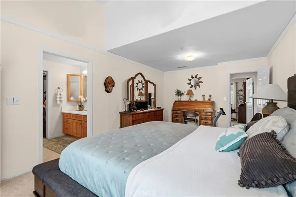 a bed room with a bed and dresser