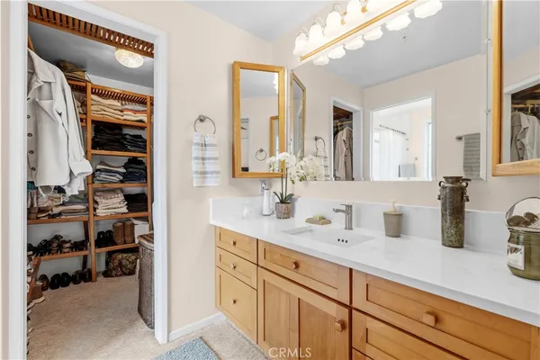 a bathroom with a sink a vanity and a mirror
