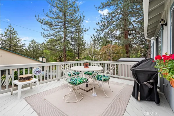 a view of a chairs and table in patio