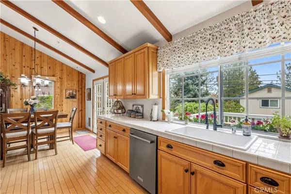 a kitchen with lots of counter top space and wooden floor