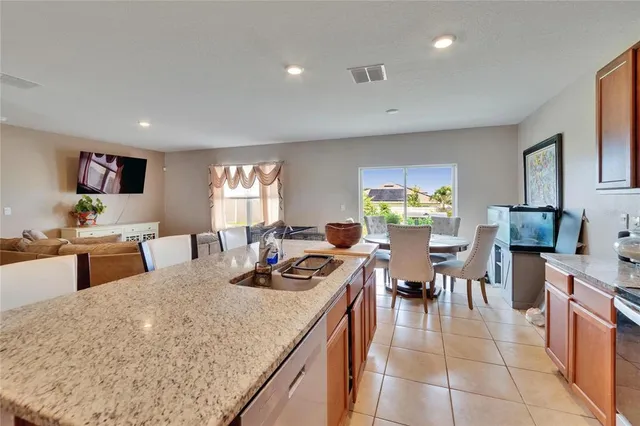 a kitchen with a refrigerator and cabinets