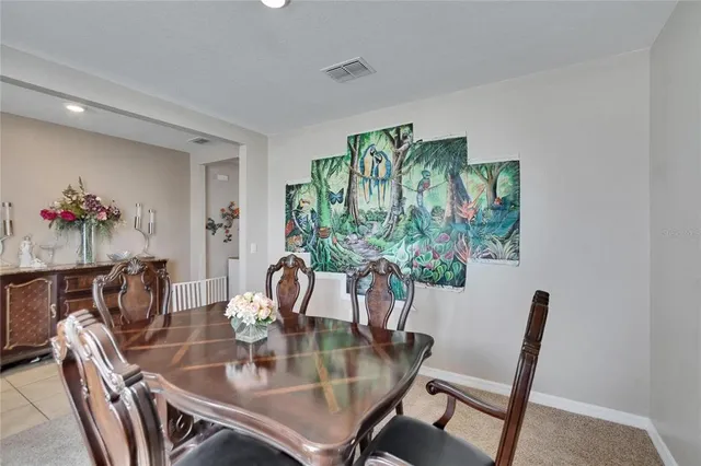 a view of a dining room and livingroom with furniture