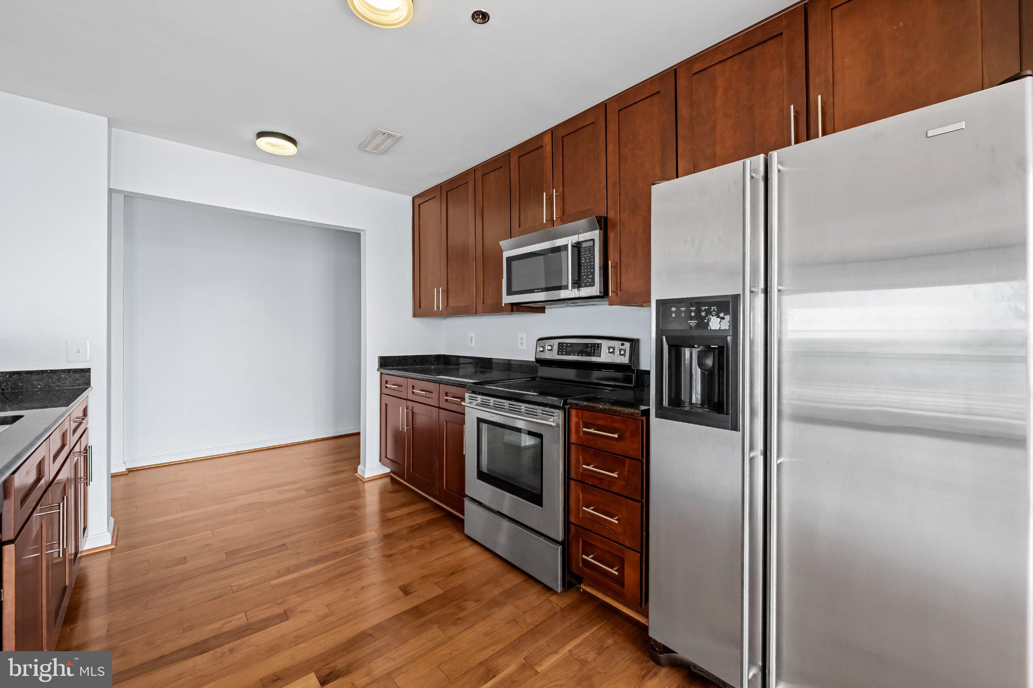 2702 Lighthouse Point East, Unit 738 Baltimore, MD 21224 - Photo 8 of 33 Modern kitchen with sleek finishes.