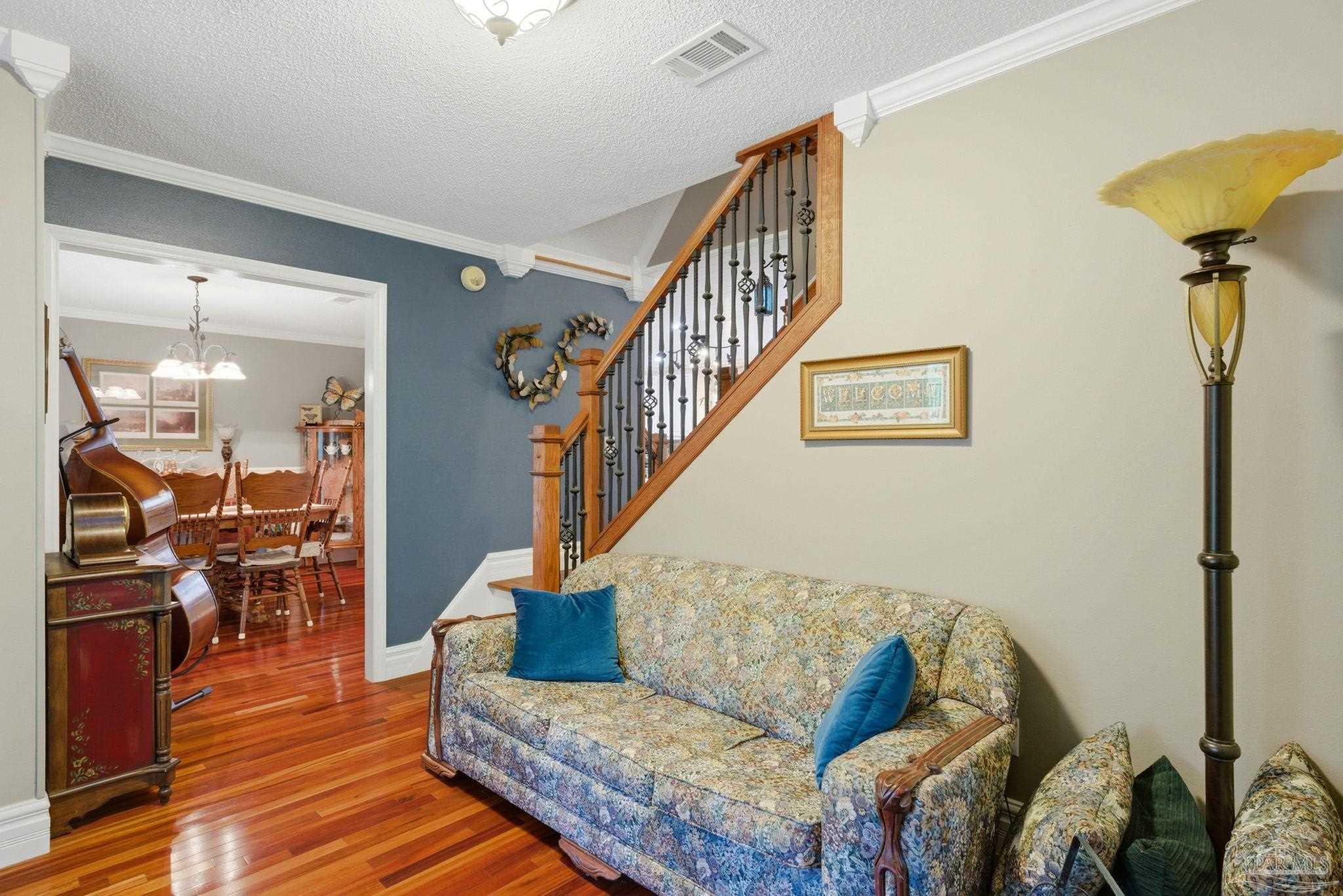 6930 Summit Way Milton, FL 32570 - Photo 5 of 71 a living room with furniture and wooden floor