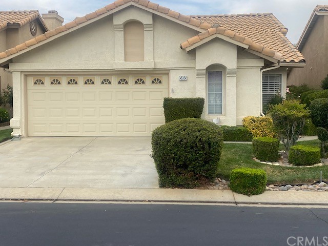 668 Pine Valley Road Banning, CA 92220 - Photo 1 of 1 a front view of a house with garden