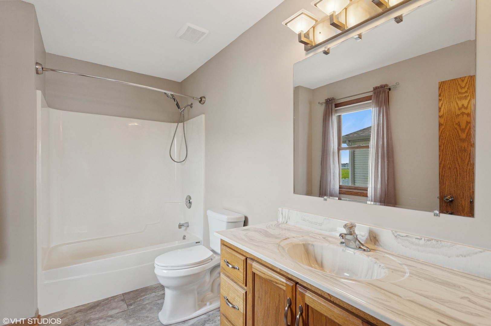 2033 Willow Brook Drive Bourbonnais, IL 60914 - Photo 11 of 24 a bathroom with a granite countertop sink toilet and shower