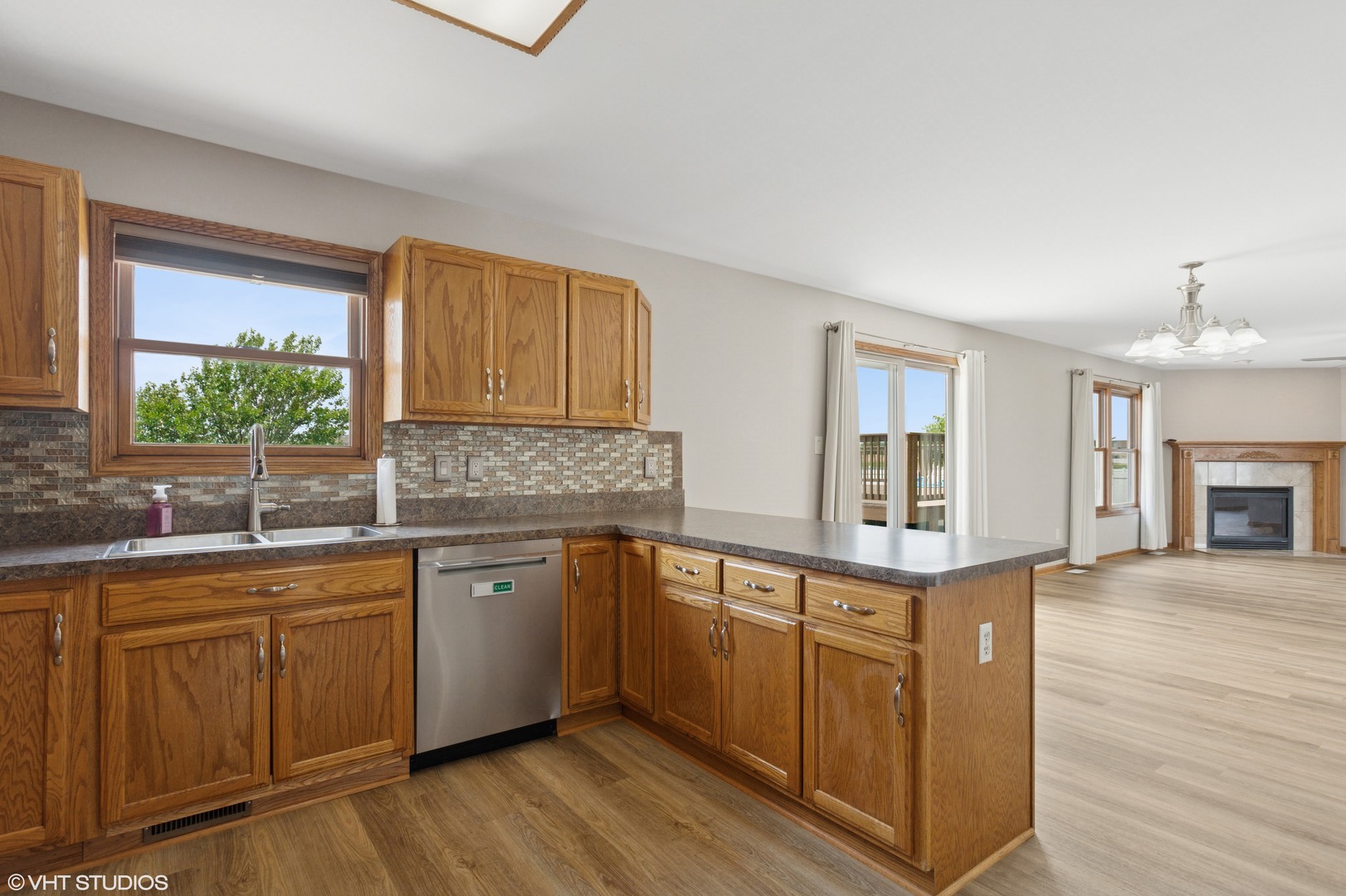 2033 Willow Brook Drive Bourbonnais, IL 60914 - Photo 5 of 24 a kitchen with sink cabinets and window