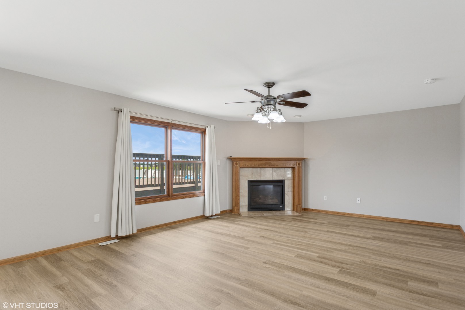 2033 Willow Brook Drive Bourbonnais, IL 60914 - Photo 7 of 24 a view of an empty room with a fireplace and a window