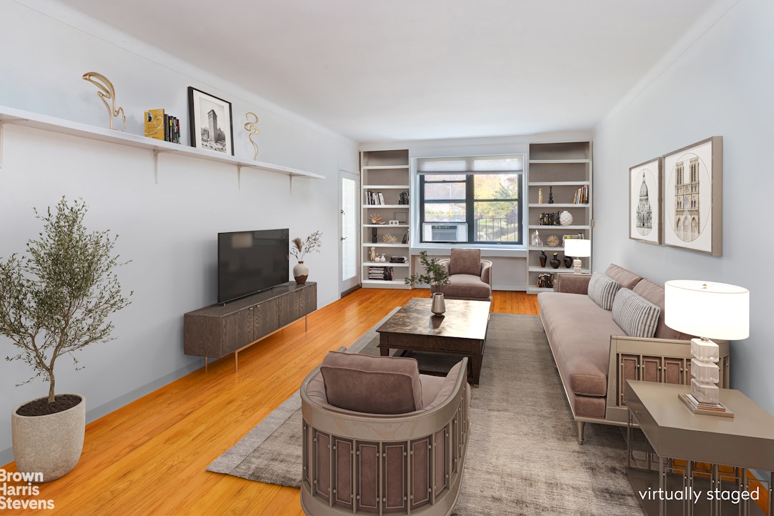 611 West 239th Street, Unit 3F Bronx, NY 10471 - Photo 1 of 12 a living room with furniture and a potted plant