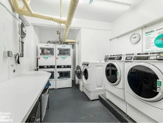a utility room with sink dryer and washer