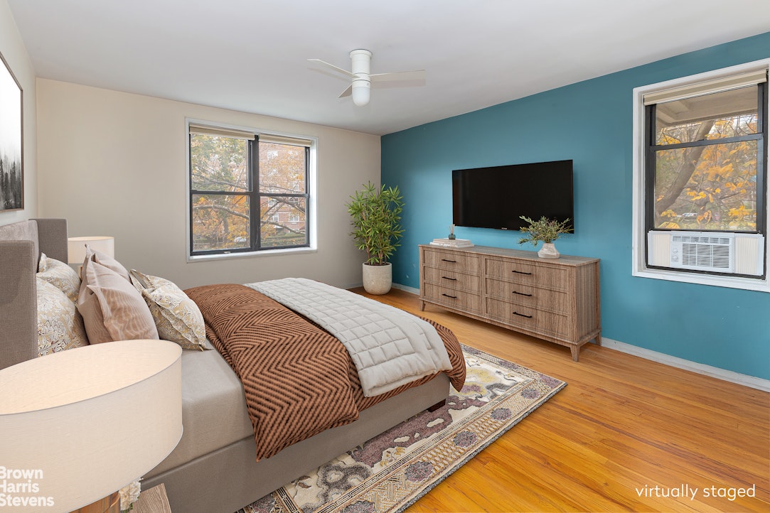 611 West 239th Street, Unit 3F Bronx, NY 10471 - Photo 5 of 12 a bedroom with a bed and a television