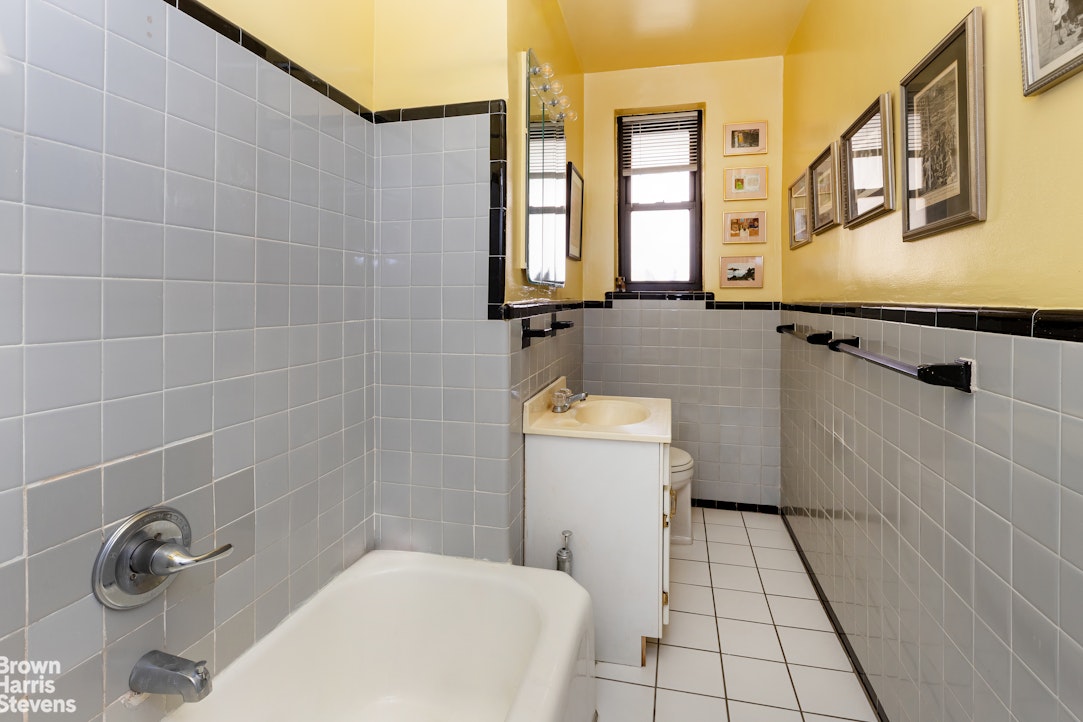 611 West 239th Street, Unit 3F Bronx, NY 10471 - Photo 8 of 12 a bathroom with a sink toilet and shower