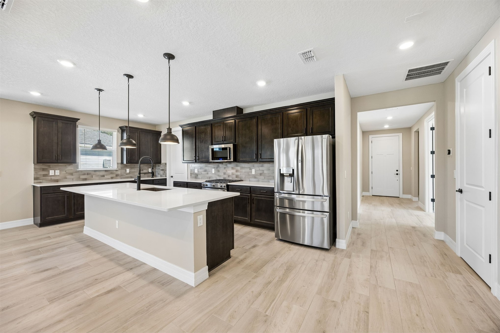 729 Continuum Loop Yulee, FL 32097 - Photo 15 of 55 Large island for casual dining.