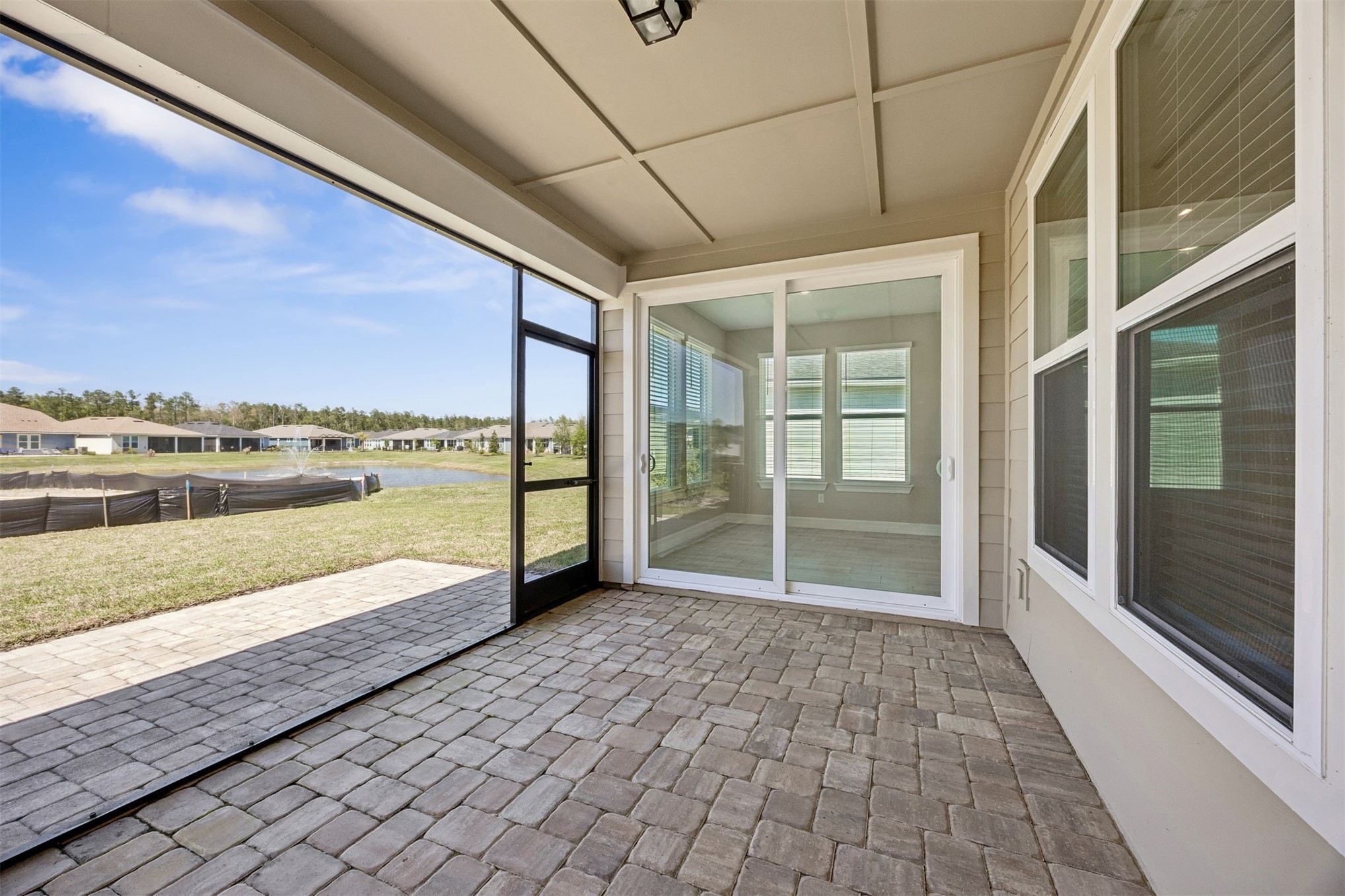729 Continuum Loop Yulee, FL 32097 - Photo 35 of 55 Relax on the lanai and enjoy the pond view.