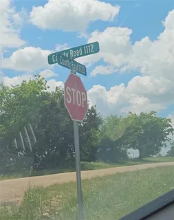 a front view of a house with a garden and shower