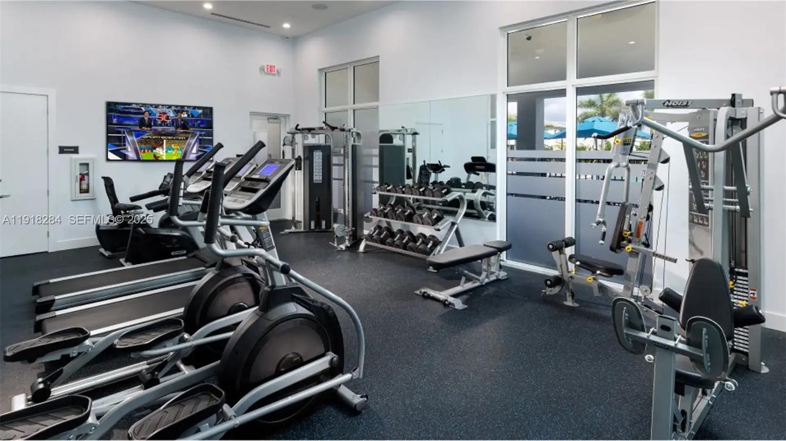 2624 Southeast 11th Court, Unit 2624 Homestead, FL 33035 - Photo 17 of 19 a view of a room with gym equipment