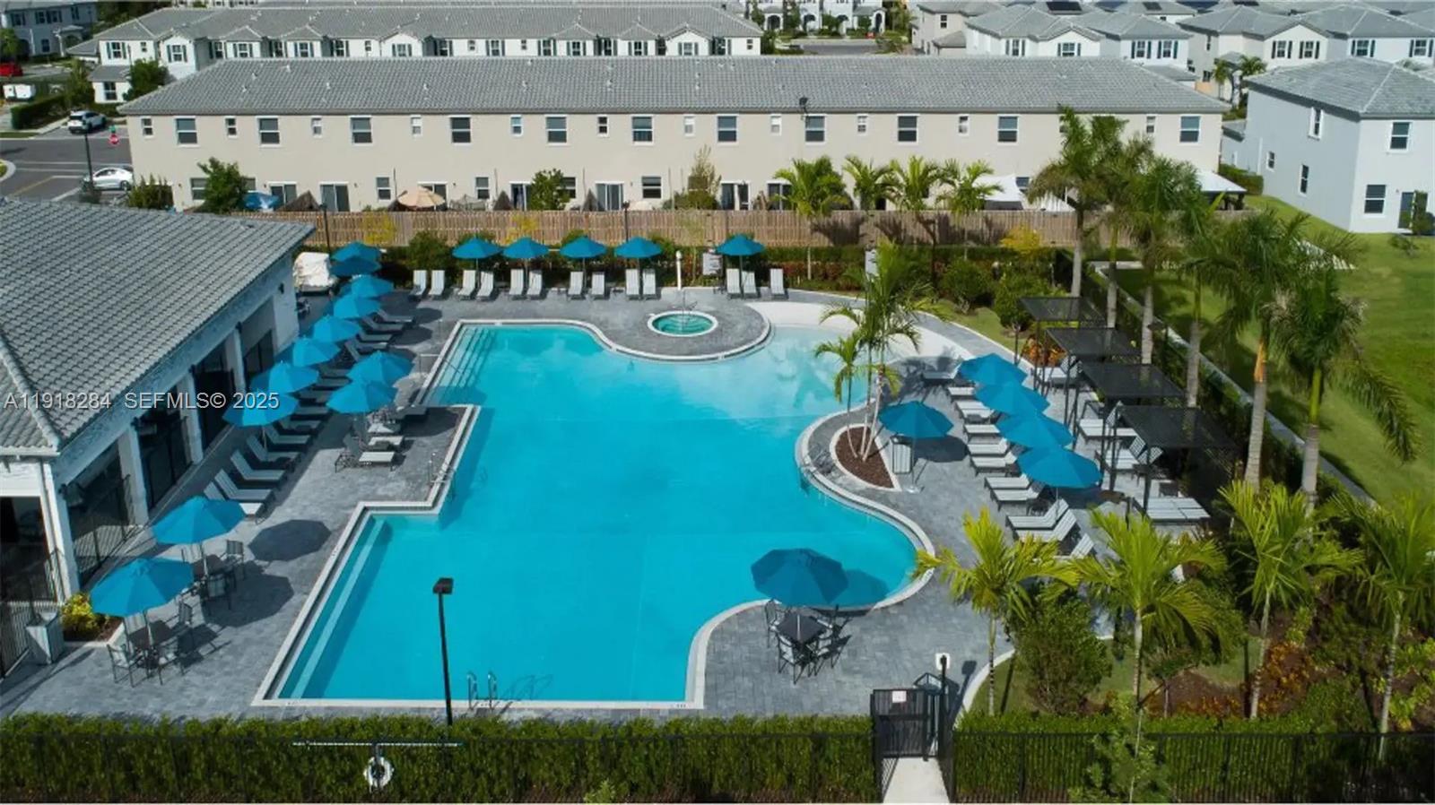 2624 Southeast 11th Court, Unit 2624 Homestead, FL 33035 - Photo 18 of 19 an aerial view of a house yard swimming pool and outdoor seating
