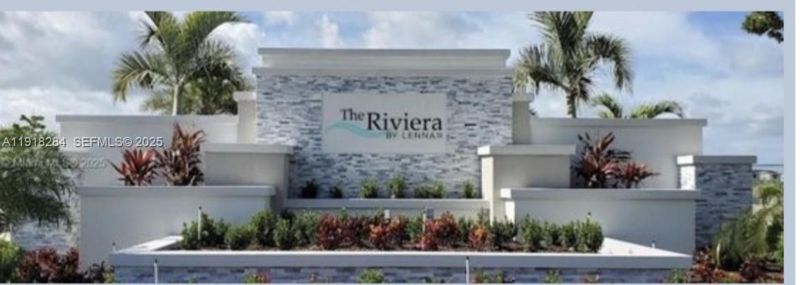 2624 Southeast 11th Court, Unit 2624 Homestead, FL 33035 - Photo 19 of 19 a front view of a house with a garden