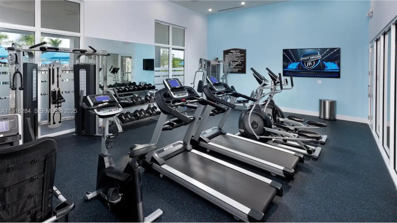 2624 Southeast 11th Court, Unit 2624 Homestead, FL 33035 - Photo 2 of 19 a view of a room with gym equipment