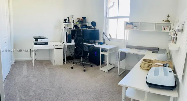 a bedroom with a bed and a night stand