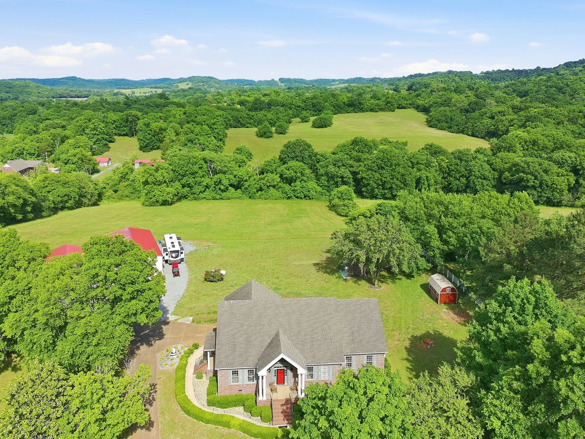 1150 Cochran Cemetery Road Lewisburg, TN 37091 - Photo 50 of 63 an aerial view of a house with a yard and lake view