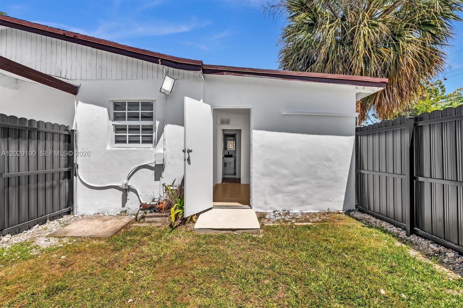 11790 Southwest 34th Street Miami, FL 33175 - Photo 46 of 56 a view of a house with backyard and sitting area
