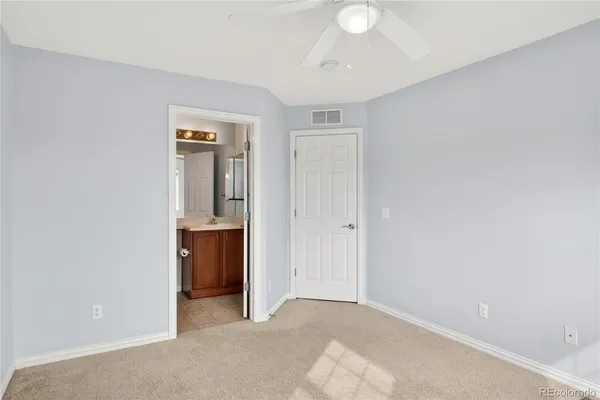 a view of an empty room with a bathroom