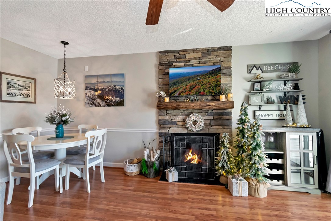 301 Pinnacle Inn Road, Unit 1215 Banner Elk, NC 28604 - Photo 13 of 47 a living room with furniture and a fireplace