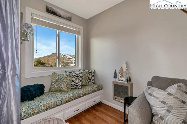 a living room with furniture and a window