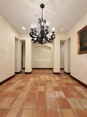 12410 Keith Road Beaumont, TX 77713 - Photo 13 of 45 a view of a room with a chandelier