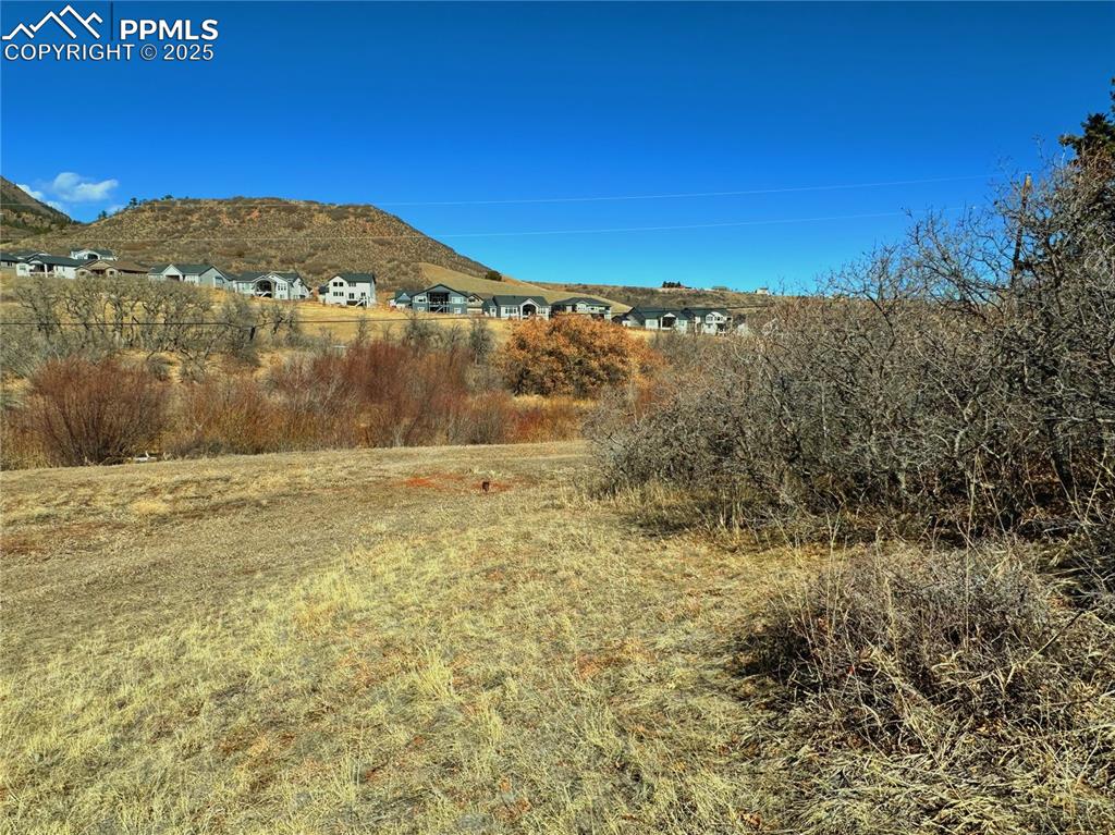 4405 Diamondback Drive Colorado Springs, CO 80921 - Photo 3 of 21 a view of a large building with mountains in the background
