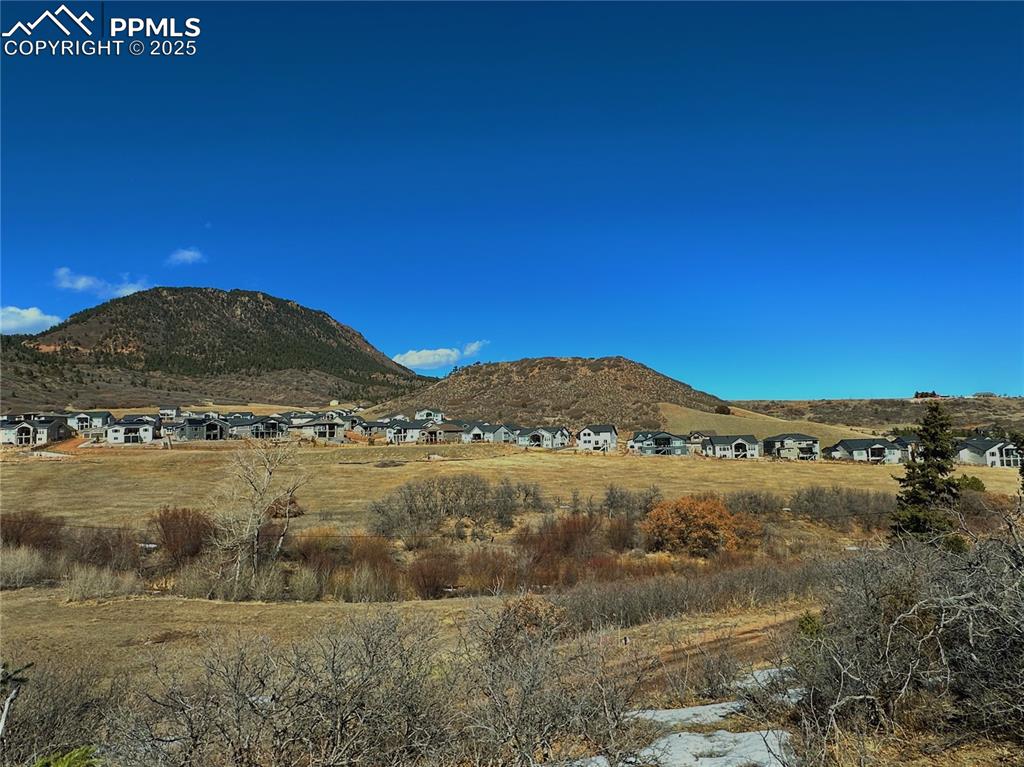 4405 Diamondback Drive Colorado Springs, CO 80921 - Photo 10 of 21 a view of large green field with mountains in the background