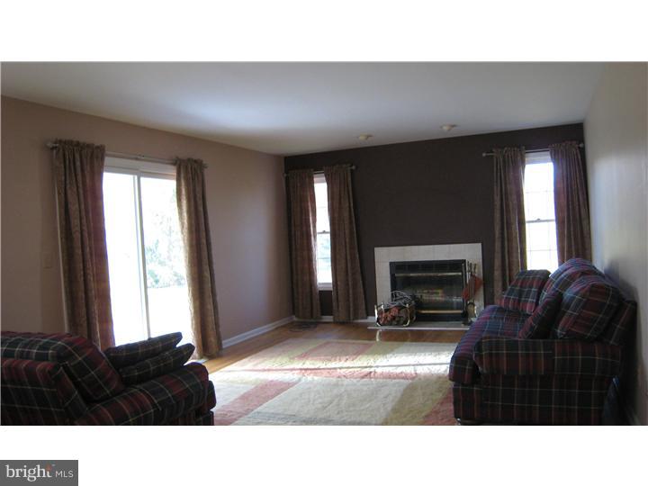 5 Millar Court West Windsor, NJ 08550 - Photo 3 of 17 a living room with furniture and a fireplace