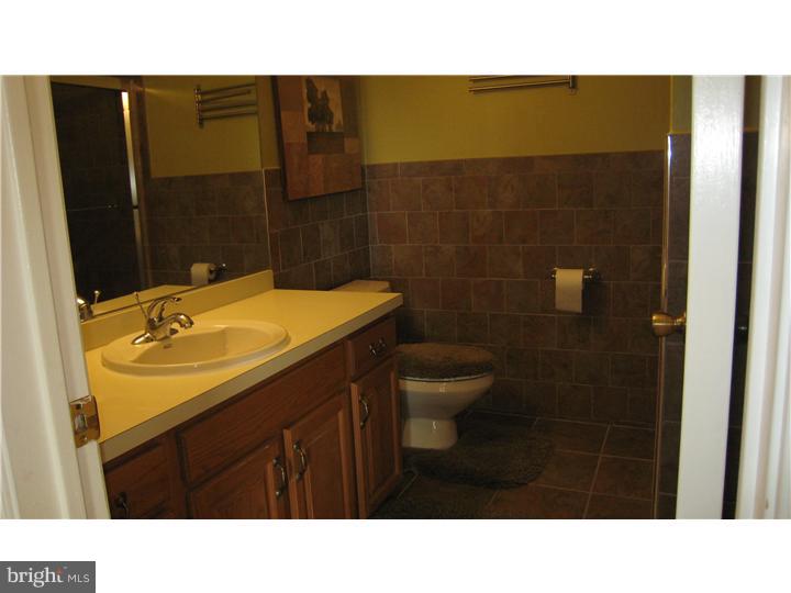 5 Millar Court West Windsor, NJ 08550 - Photo 8 of 17 a bathroom with a sink a toilet and mirror